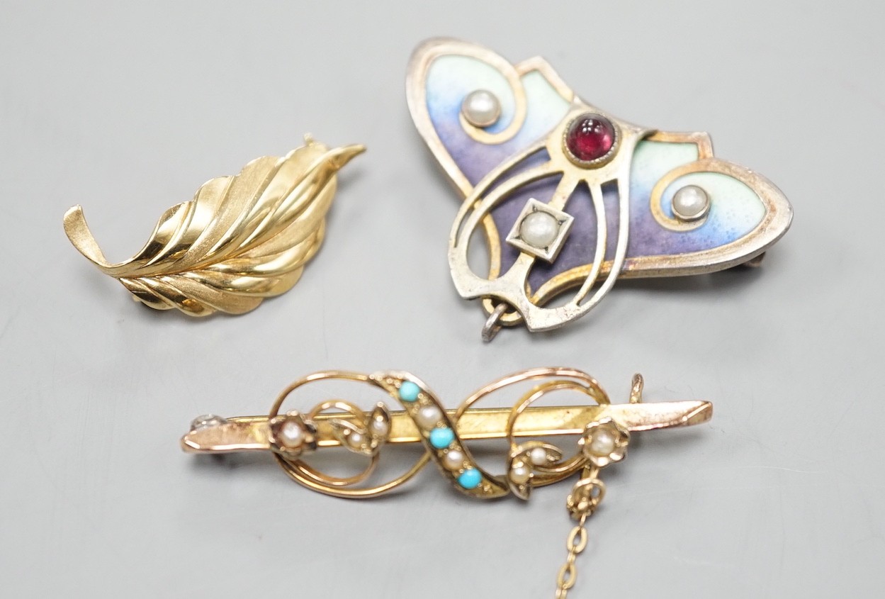 A continental Art Nouveau 900 gilt white metal, cabochon stone, seed pearl and enamel set brooch, 36mm and two 9ct brooches including gem set, 9ct gross 4.2 grams.